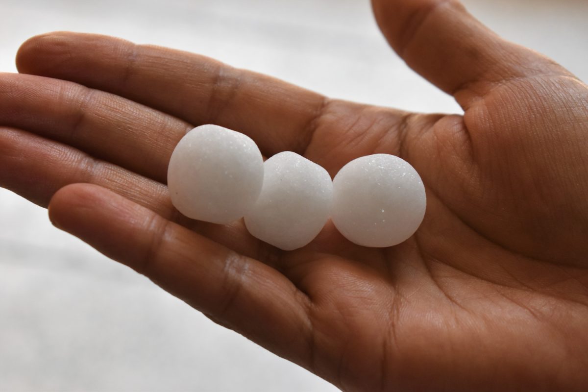 White naphthalene balls in hand
